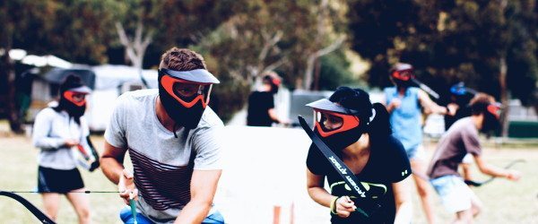 Two Archery Attack players discussing tactics during Arrow Tag