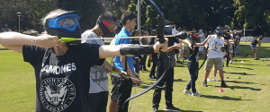 Line of archers playing Arrow Tag